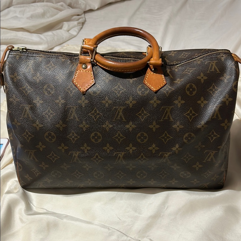 Louis Vuitton Brown Duffel Bag with Iconic Monogram and Leather Trim - Picture 2 of 16